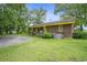 Brick house with yellow trim and a well-maintained lawn at 1731 Lee Ln., Longs, SC 29568