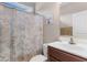 Bathroom features vanity with floral shower curtain and bright light at 177 Baylee Circle, Galivants Ferry, SC 29544