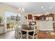 Open dining area adjacent to the kitchen, featuring ample light from the sliding door at 177 Baylee Circle, Galivants Ferry, SC 29544