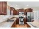 Modern kitchen with stainless steel appliances, wood cabinets, and laminate countertops at 177 Baylee Circle, Galivants Ferry, SC 29544