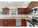 Updated kitchen with dark wood cabinetry, stainless steel appliances, and practical layout at 177 Baylee Circle, Galivants Ferry, SC 29544
