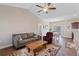 Spacious living room featuring a vaulted ceiling, comfortable seating, and views into the dining area at 177 Baylee Circle, Galivants Ferry, SC 29544