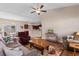 Open-concept living room with kitchen and dining areas, ceiling fan, and comfortable seating at 177 Baylee Circle, Galivants Ferry, SC 29544
