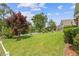 Expansive backyard with a view of a tranquil lake and lush landscaping at 1776 Starbridge Dr., Surfside Beach, SC 29575