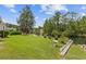 Serene backyard with lush green lawn, waterfront views, and well-manicured landscaping at 1776 Starbridge Dr., Surfside Beach, SC 29575