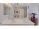 Bathroom with double sinks, a large mirror, and access to a shower and toilet at 1776 Starbridge Dr., Surfside Beach, SC 29575