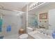 Clean bathroom features a shower with glass doors, neutral tile, and modern fixtures at 1776 Starbridge Dr., Surfside Beach, SC 29575