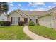 Well-maintained lawn with landscaping leads to the front door of this charming single-story home at 1776 Starbridge Dr., Surfside Beach, SC 29575