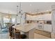 Well-equipped kitchen with white cabinets, a large island, and open access to the dining area at 1776 Starbridge Dr., Surfside Beach, SC 29575
