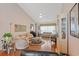 Spacious and airy living room featuring vaulted ceilings, hardwood floors, and ample natural light at 1776 Starbridge Dr., Surfside Beach, SC 29575