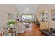 Bright living room showcasing a vaulted ceiling, hardwood floors, and a comfortable seating area at 1776 Starbridge Dr., Surfside Beach, SC 29575