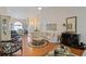 Spacious living area with hardwood floors flows into an open dining area and kitchen at 1776 Starbridge Dr., Surfside Beach, SC 29575