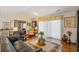 Open concept living room with hardwood floors, lots of light, and comfortable furniture at 1776 Starbridge Dr., Surfside Beach, SC 29575