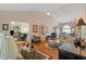 Expansive living room with hardwood floors and open floorplan to dining area and kitchen at 1776 Starbridge Dr., Surfside Beach, SC 29575