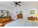 Bright main bedroom featuring hardwood floors, large mirrors, and plenty of storage space at 1776 Starbridge Dr., Surfside Beach, SC 29575