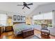 Spacious main bedroom with vaulted ceiling, a ceiling fan, and a large window with a view at 1776 Starbridge Dr., Surfside Beach, SC 29575