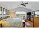 Well-lit main bedroom with a large window, vaulted ceiling, and stylish furnishings at 1776 Starbridge Dr., Surfside Beach, SC 29575