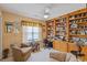 Cozy office space features custom built-in shelving, ceiling fan, and natural light at 1776 Starbridge Dr., Surfside Beach, SC 29575