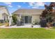 Cozy patio area with outdoor seating, grill, and lush landscaping provides a relaxing retreat at 1776 Starbridge Dr., Surfside Beach, SC 29575