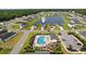 Community aerial view showcasing the pool, playground, lake and residential homes at 196 Cypress Tree Loop, Longs, SC 29568