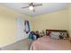 Bedroom featuring a neutral carpet and furnishings, with closet door at 196 Cypress Tree Loop, Longs, SC 29568