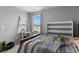 Comfortable bedroom featuring ample natural light and convenient shelving for storage and display at 196 Cypress Tree Loop, Longs, SC 29568