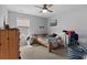 Simple bedroom design with neutral tones, a ceiling fan, and a window with natural light at 196 Cypress Tree Loop, Longs, SC 29568