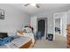 Neutral-toned bedroom with essential furnishings; a cozy and functional space for rest and relaxation at 196 Cypress Tree Loop, Longs, SC 29568