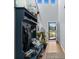 Welcoming entryway with mudroom station, coat hooks, and an open front door at 196 Cypress Tree Loop, Longs, SC 29568