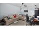 Comfortable living room featuring a plush sectional sofa and study space at 196 Cypress Tree Loop, Longs, SC 29568