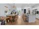 Inviting open floorplan showcases a dining area and kitchen with modern amenities and breakfast bar seating at 196 Cypress Tree Loop, Longs, SC 29568