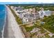 Expansive aerial view of a beachfront resort showcasing the hotel and its proximity to the sandy beach and ocean at 201 77Th Ave. N # 1133, Myrtle Beach, SC 29572