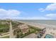 Wide shot of coastline featuring hotels, private residences, pools, and sandy beach at 201 77Th Ave. N # 1133, Myrtle Beach, SC 29572