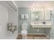 An accessible bathroom featuring a shower seat, sink, mirror, and toilet at 201 77Th Ave. N # 1133, Myrtle Beach, SC 29572
