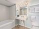 A bathroom features a tub, sink, mirror and towels at 201 77Th Ave. N # 1133, Myrtle Beach, SC 29572