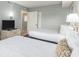 The bedroom features two beds, a TV, and access to the bathroom at 201 77Th Ave. N # 1133, Myrtle Beach, SC 29572