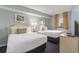 This bedroom offers two beds, a dresser, and soft lighting at 201 77Th Ave. N # 1133, Myrtle Beach, SC 29572