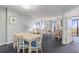 Dining area featuring a table for six, balcony view, and open floor plan at 201 77Th Ave. N # 1133, Myrtle Beach, SC 29572