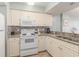 Well-equipped kitchen with appliances and tiled backsplash at 201 77Th Ave. N # 1133, Myrtle Beach, SC 29572