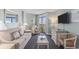 Inviting living room with neutral colors, comfortable furniture, and natural light from the balcony at 201 77Th Ave. N # 1133, Myrtle Beach, SC 29572