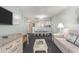 Bright living room with an open layout, comfortable furniture, and adjacent dining area at 201 77Th Ave. N # 1133, Myrtle Beach, SC 29572