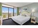 Serene main bedroom with balcony access and comfortable bedding at 201 77Th Ave. N # 1133, Myrtle Beach, SC 29572