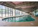Bright indoor pool area featuring ample seating, and well maintained landscaping at 201 77Th Ave. N # 1133, Myrtle Beach, SC 29572