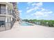 Inviting outdoor pool with seating area; watch the Gathering swim at 201 77Th Ave. N # 1133, Myrtle Beach, SC 29572