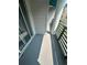 This view features a spacious balcony with a column and green railings, offering a relaxing outdoor space at 201 Hillside Dr. N # 111, North Myrtle Beach, SC 29582