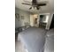 Comfortable bedroom offers mirrored closet doors, a ceiling fan, and neutral decor at 201 Hillside Dr. N # 111, North Myrtle Beach, SC 29582