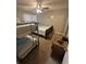 Comfortable bedroom with bunk beds, a regular bed, and a wooden dresser at 201 Hillside Dr. N # 111, North Myrtle Beach, SC 29582