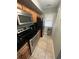 Efficient kitchen features stainless steel appliances, granite countertops, and ample wooden cabinetry at 201 Hillside Dr. N # 111, North Myrtle Beach, SC 29582