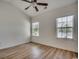 Spacious bedroom filled with natural light from two windows and modern ceiling fan at 204 Rose Water Loop # 204, Myrtle Beach, SC 29588