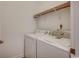 Practical laundry area with modern washer and dryer, plus overhead shelf for storage at 204 Rose Water Loop # 204, Myrtle Beach, SC 29588